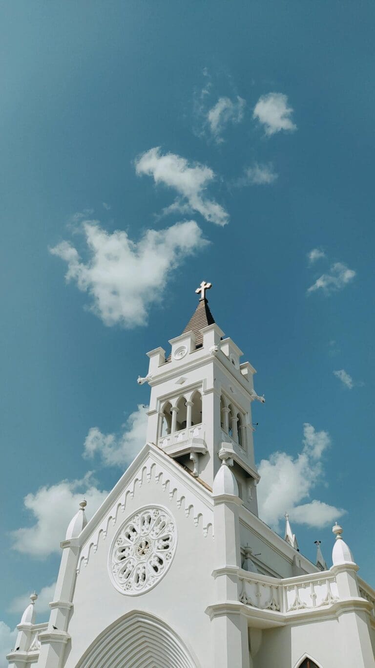 White Cathedral under Blue Sky with White Clouds
