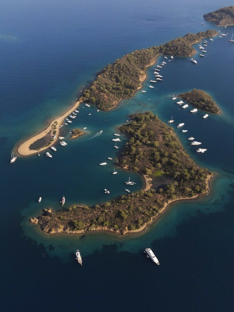Aerial Photo of Few Islands Surrounded by Boats