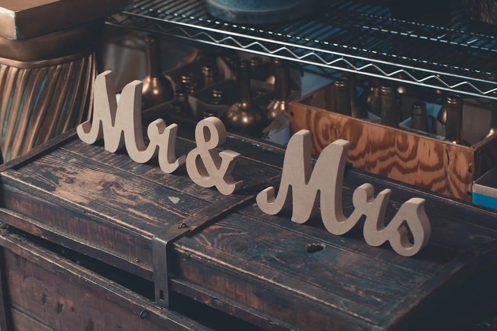 Gray Mr & Mrs Decors on Brown Wooden Trunk