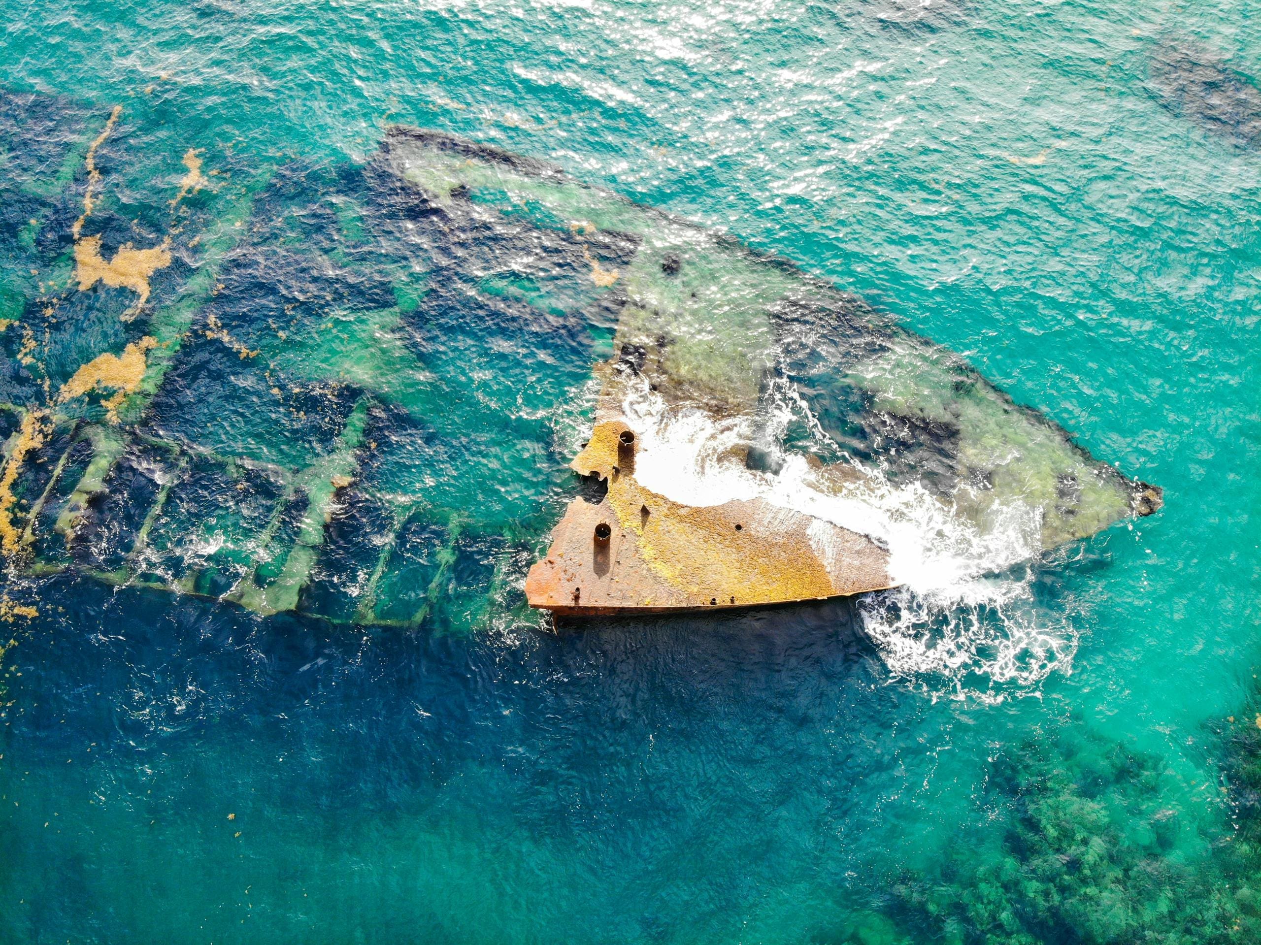 Aerial View of Shipwreck in the Middle of Ocean